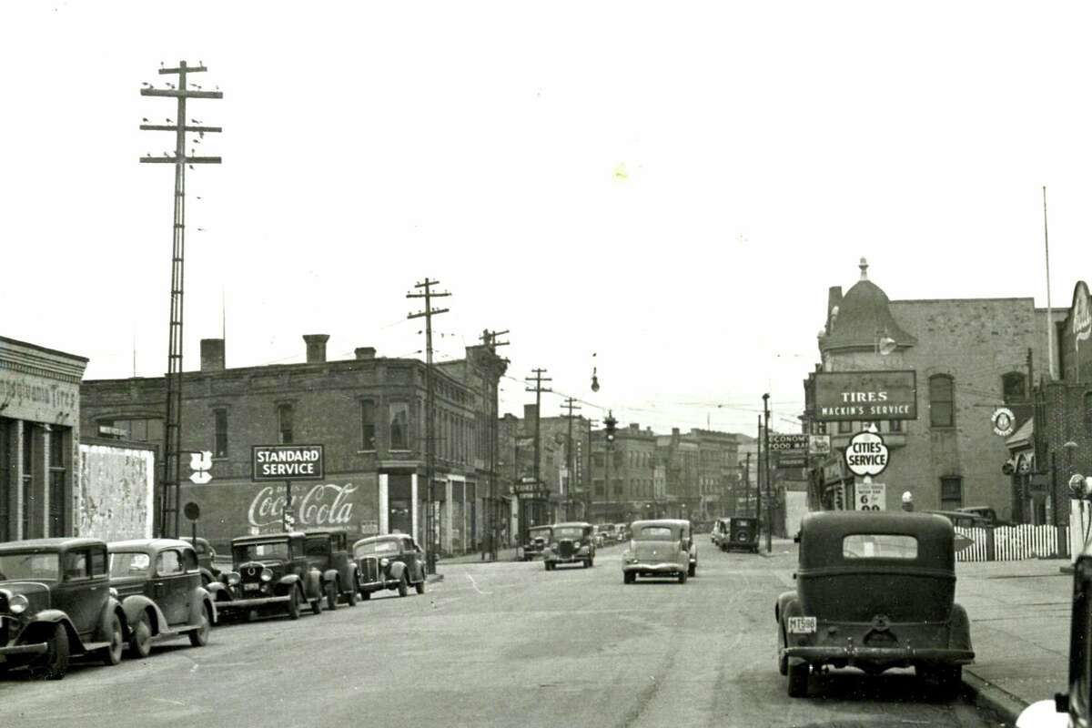 This photo shows a view looking west down River Street near Cypress Street circa 1938. (Manistee County Historical Museum photo)