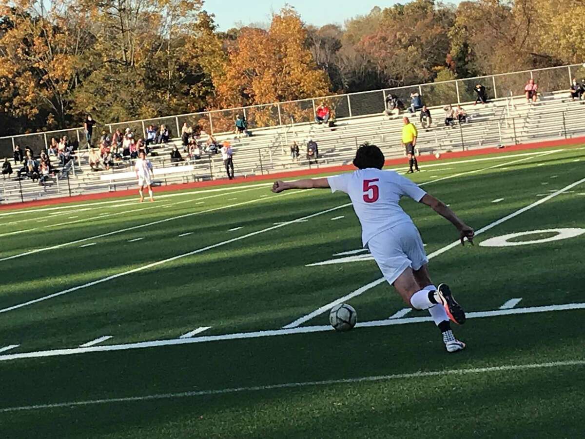 Irving Dorman of New Canaan takes a free kick during a boys soccer game between the Cardinals and New Canaan in the semifinals of the FCIAC West Region Tournament on Friday, Nov. 6, 2020, in Greenwich, Connecticut.