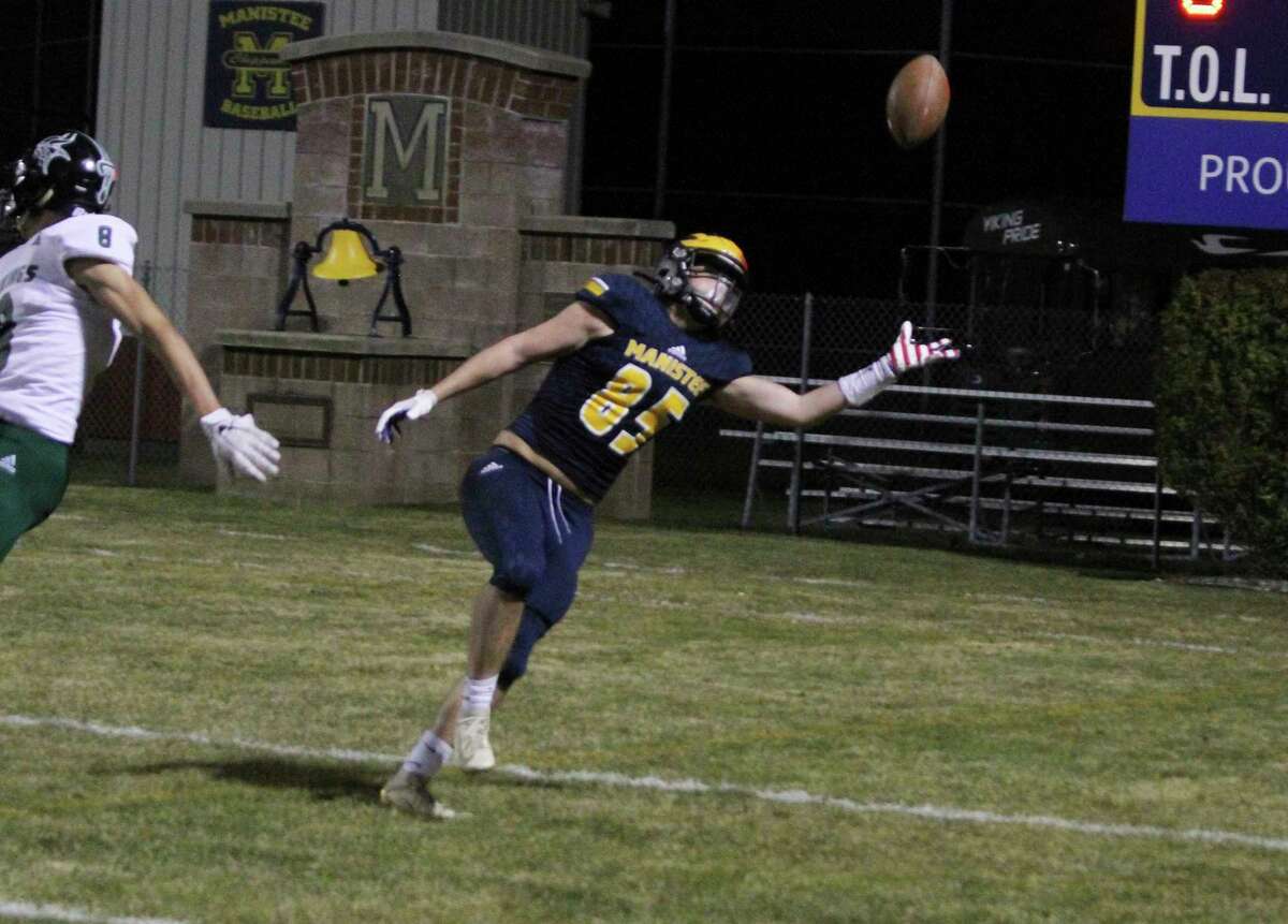 A pass falls just out of the reach of Manistee receiver Eric Smith on Friday night at Chippewa Field. Manistee's season came to a close in the playoff loss to Grayling. (Dylan Savela/News Advocate)