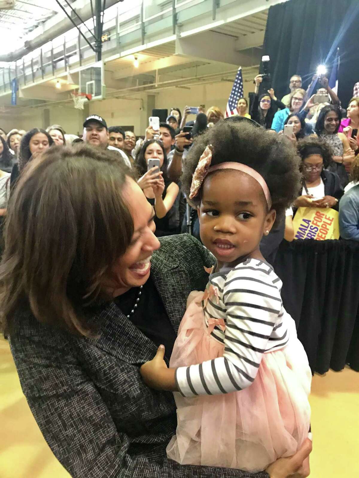 U.S. Sen. Kamala Harris talks with 2-year-old Urennaya “Ure” Unaka during a stop in Houston in 2018. Harris met the little girl again in 2020 in Houston, when Ure showed her the earlier photo.