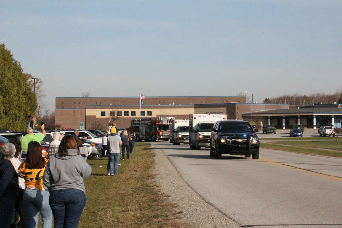 The Bad Axe football team was escorted from the school Saturday November 7 on their way to play the Hemlock Huskies in the district semifinals. Many fans came out to wish the players well.