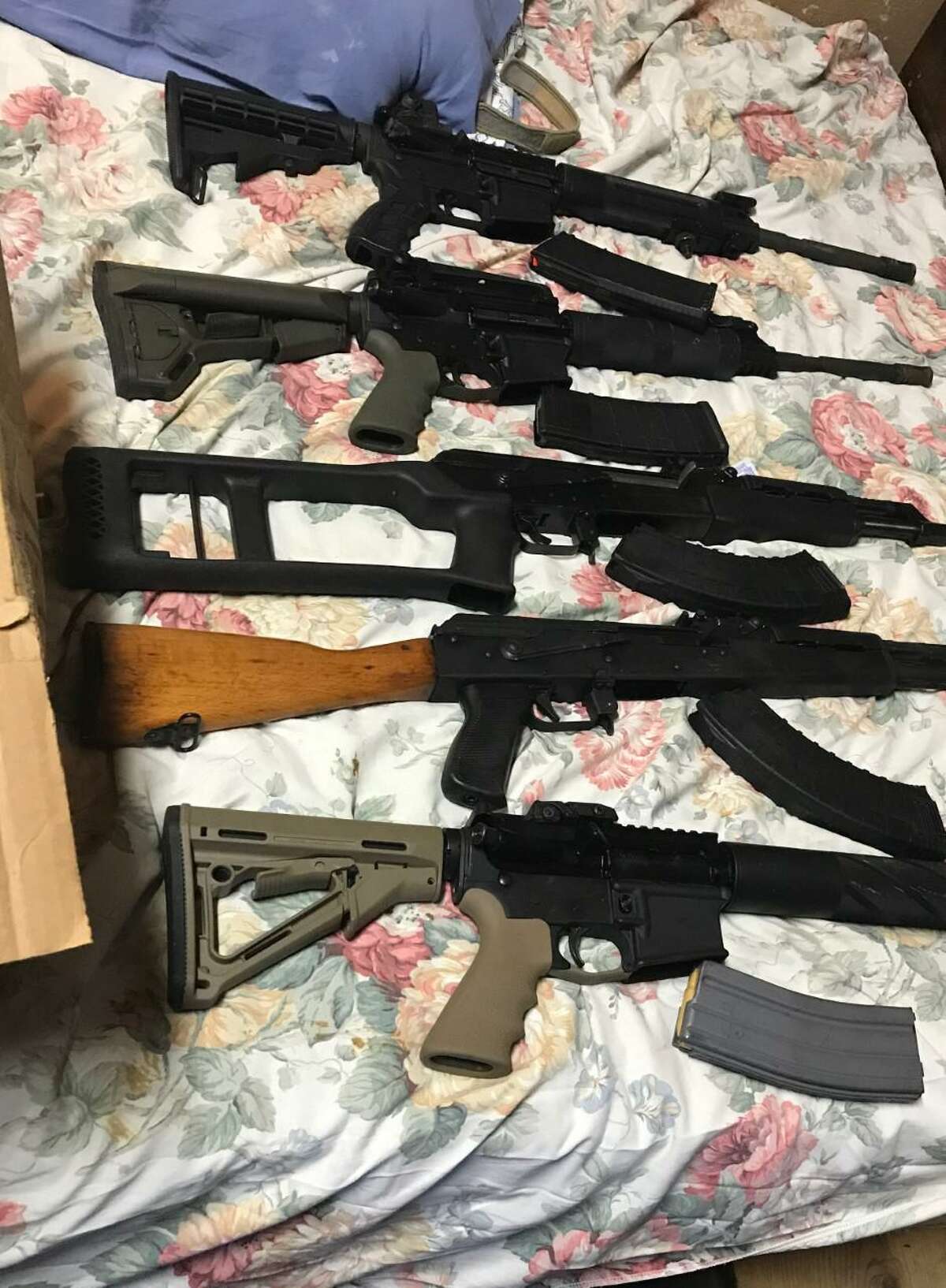 Federal authorities said they seized these firearms during an operation that landed seven people behind bars.