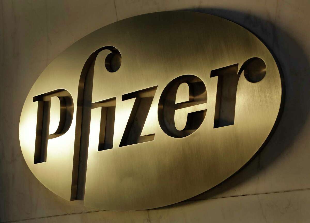 FILE - In this Monday, Nov. 23, 2015, file photo, the Pfizer logo is displayed at world headquarters in New York. On Monday, Nov. 9, 2020, Pfizer said an early peek at its vaccine data suggests the shots may be 90% effective at preventing COVID-19.