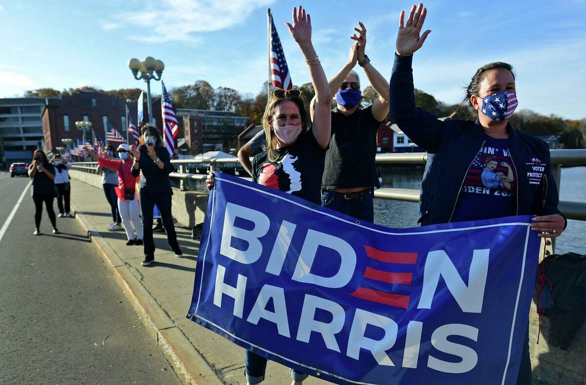 Folks gathered for a last-minute rally at the Ruth Steinkraus bridge in downtown Westport on Saturday, in celebration of former Vice President Joe Biden and U.S. Sen. Kamala Harris' winning the 2020 presidential race over President Donald Trump and Vice President Mike Pence.