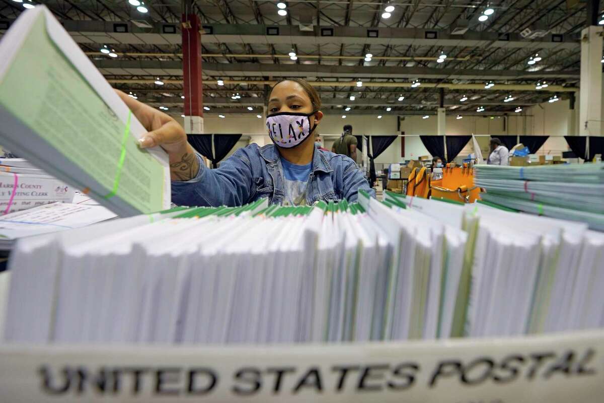 A Harris County election worker prepares mail-in ballots in September. President Donald Trump has made repeated unfounded claims of voter fraud — but there are ways to combat such allegations. to be sent out to voters Tuesday, Sept. 29, 2020, in Houston. (AP Photo/David J. Phillip)