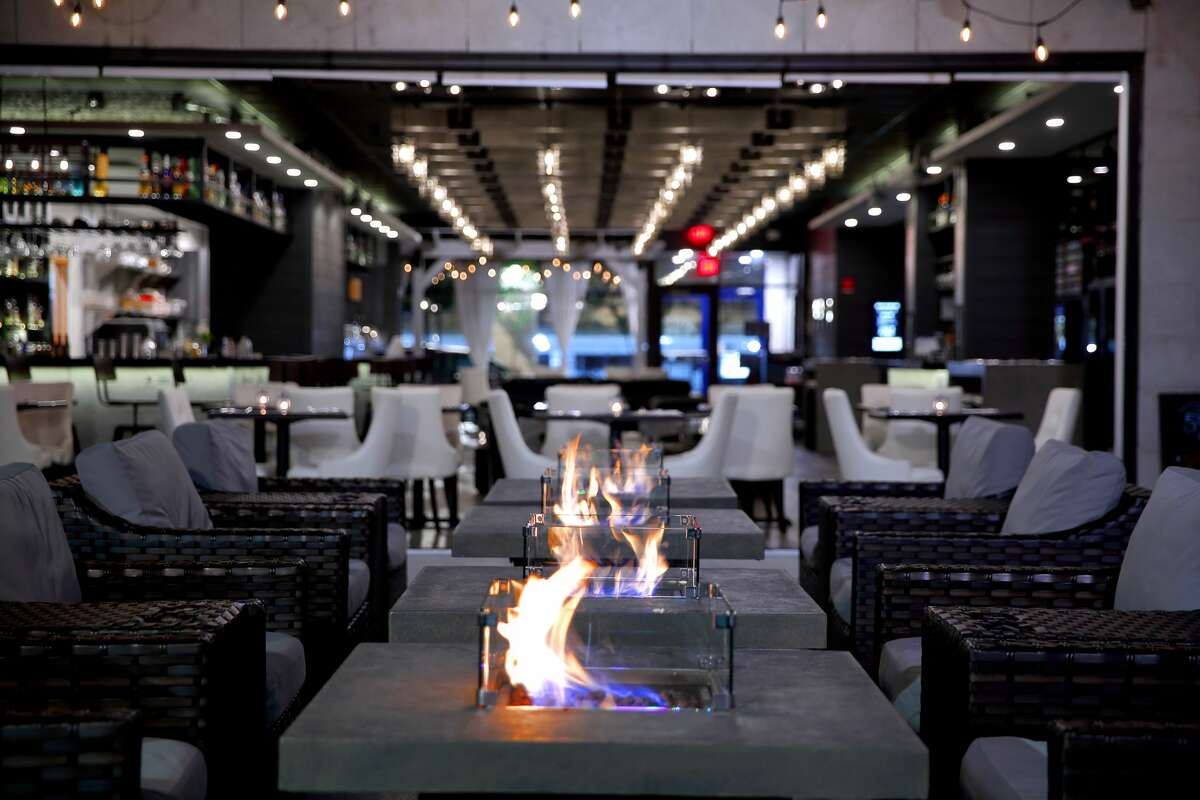 The Shaker & Vine's indoor fire pits, which set the mood. The Schenectady restaurant had igloo-like structures for outdoor dining, but will  not continue using those in the winter of 2020.