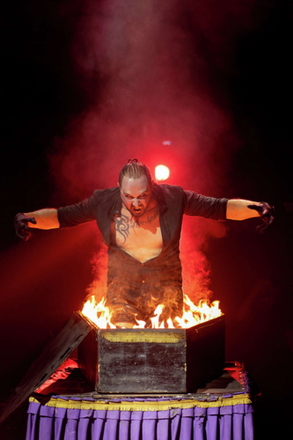 James Giroldini works the Fire Coffin in Paranormal Cirque, which comes to Ford Park on Nov. 12, 2020.