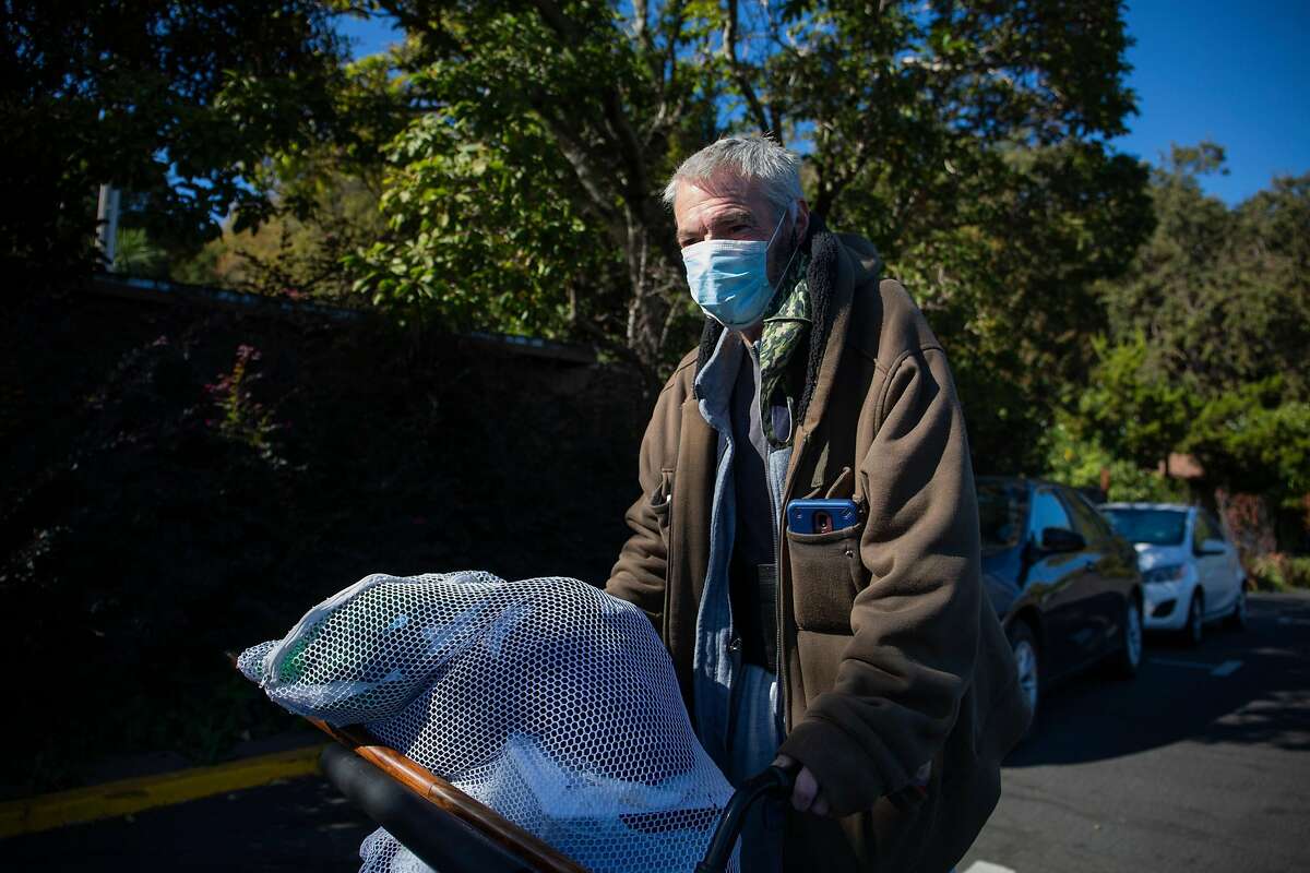 Richard Hoyt, walking near the Inn Marin Hotel in Novato, says he has applied for housing for nine years in Marin County but remains homeless.