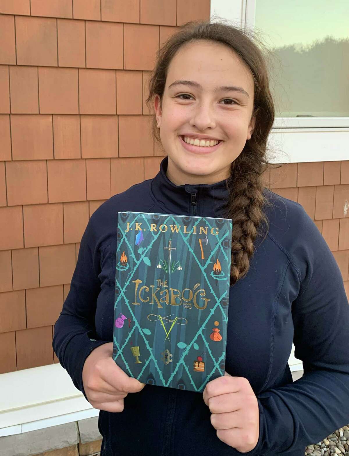 Isla Besha, 12, of Altamont holds a signed copy of J.K. Rowling?•s new book ?’The Ickabog.?“ The Woodland Hill Montessori School student was one of 34 artists chosen to illustrate the North American edition of the latest tale from the author of the ?’Harry Potter?“ series. (Provided photo)