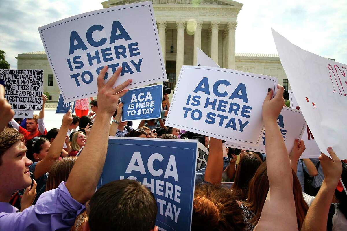 FILE -- Supporters of the Affordable Care Act outside the Supreme Court in Washington, June 25, 2015. Eight years ago, the Affordable Care Act barely survived its first encounter with the Supreme Court — on Nov. 10, 2020, a significantly more conservative court will hear arguments in a case brought by Republican state officials, backed by the Trump administration, seeking to destroy it. (Doug Mills/The New York Times)