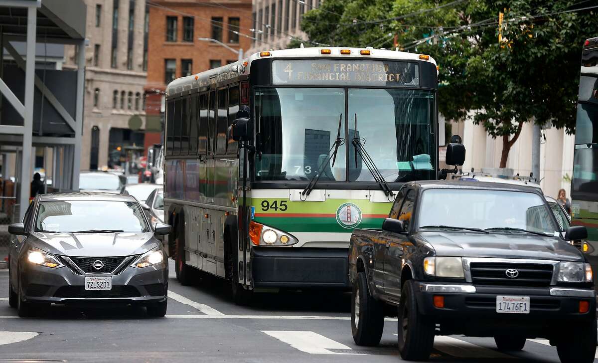 A Golden Gate Transit bus travels on First Street towards the Transbay Transit Center in San Francisco, Calif. on Friday, Sept. 27, 2019. The Golden Gate Bridge, Highway and Transportation District must cut a quarter of its positions, raise tolls on drivers coming from Marin to San Francisco or a combination of both to keep the agency afloat.