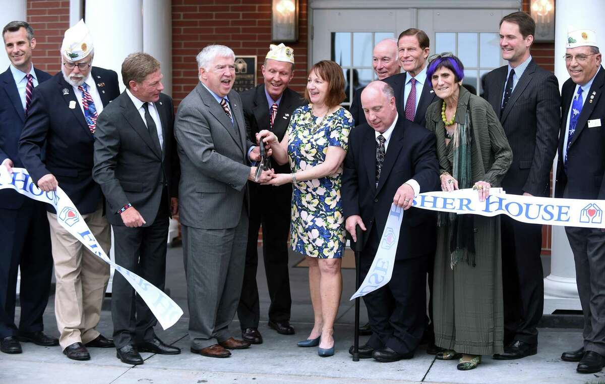 Kevin Creed, fourth from left, at the dedication of the VA Connecticut Fisher House in West Haven May 4, 2018.