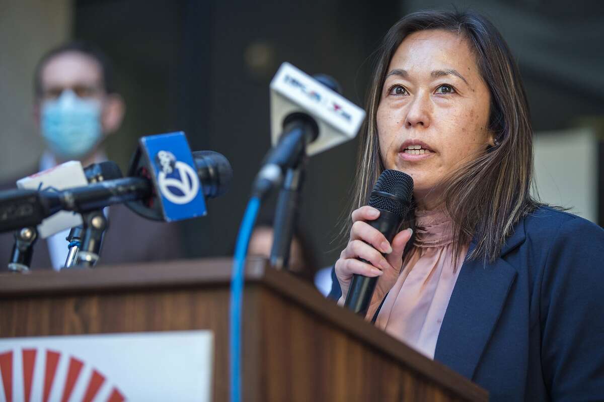 SF Board of Education Commissioner Jenny Lam speaks at an event in front of SFUSD headquarters. Jenny Lam co-authored a proposal to bring back students starting Jan. 25.