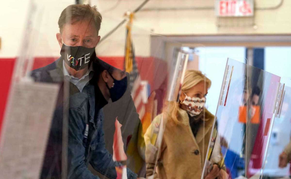 Governor Ned Lamont prepares to cast his vote at Greenwich High School in Greenwich, Connecticut, on November 3, 2020. (Photo by TIMOTHY A. CLARY/AFP via Getty Images)