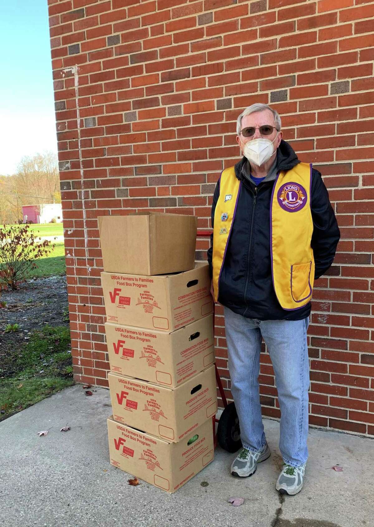 The New Milford Lions Club continues to support the community during the pandemic. The club recently delivered 70 boxes of produce, meat, cheese and other goods, along with 75 gallons of milk, to New Milford Social Services. Five boxes of items were also delivered to Loaves and Fishes Hospitality House. Above, Lion President John Dunne makes the delivery.