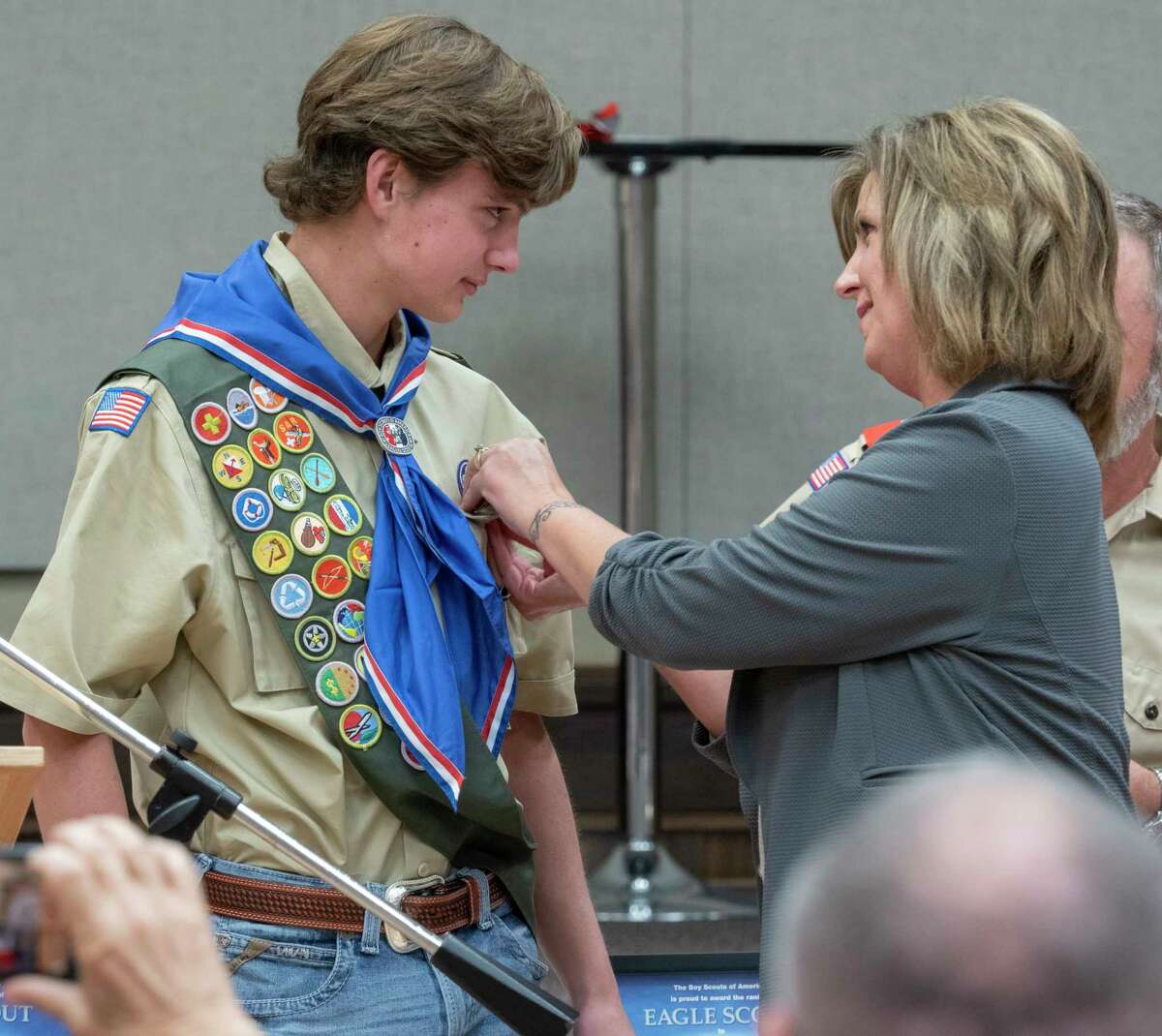 Kyle Cheatham his Eagle pin from his mother, Michele Cheatham 11/09/2020 during a ceremony honoring 6 Scouts from Troop 232 who earned the rank of Eagle. Tim Fischer/Reporter-Telegram