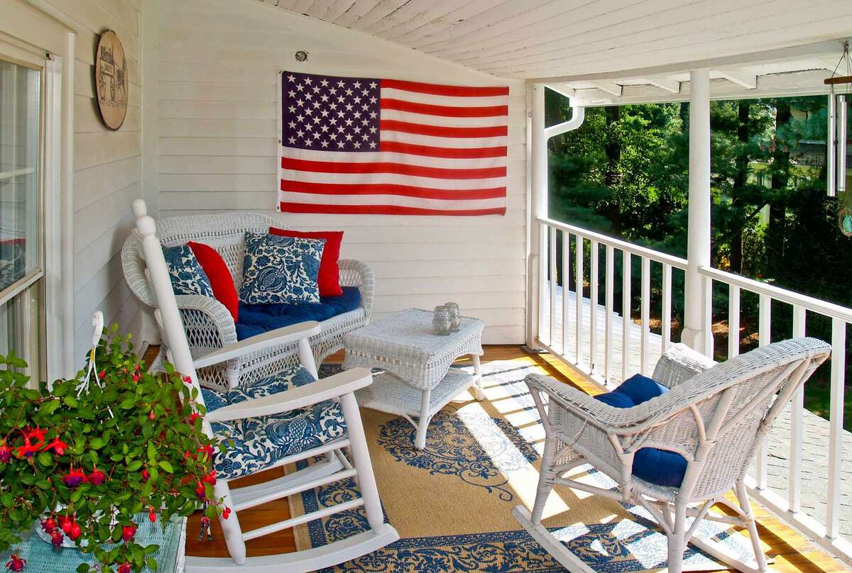 The owners can enjoy views of Gray's Creek and stunning sunsets from the second floor covered porch or balcony. Gray's Creek offers scenic beauty, just across the street from this house. These tidal waters spill into Long Island Sound about a block or two away. The house is oriented on the property to give it a western exposure, and therefore enjoys some spectacular sunsets. The water views and sunsets can be seen from the ground level covered porch and from the second floor covered balcony.
