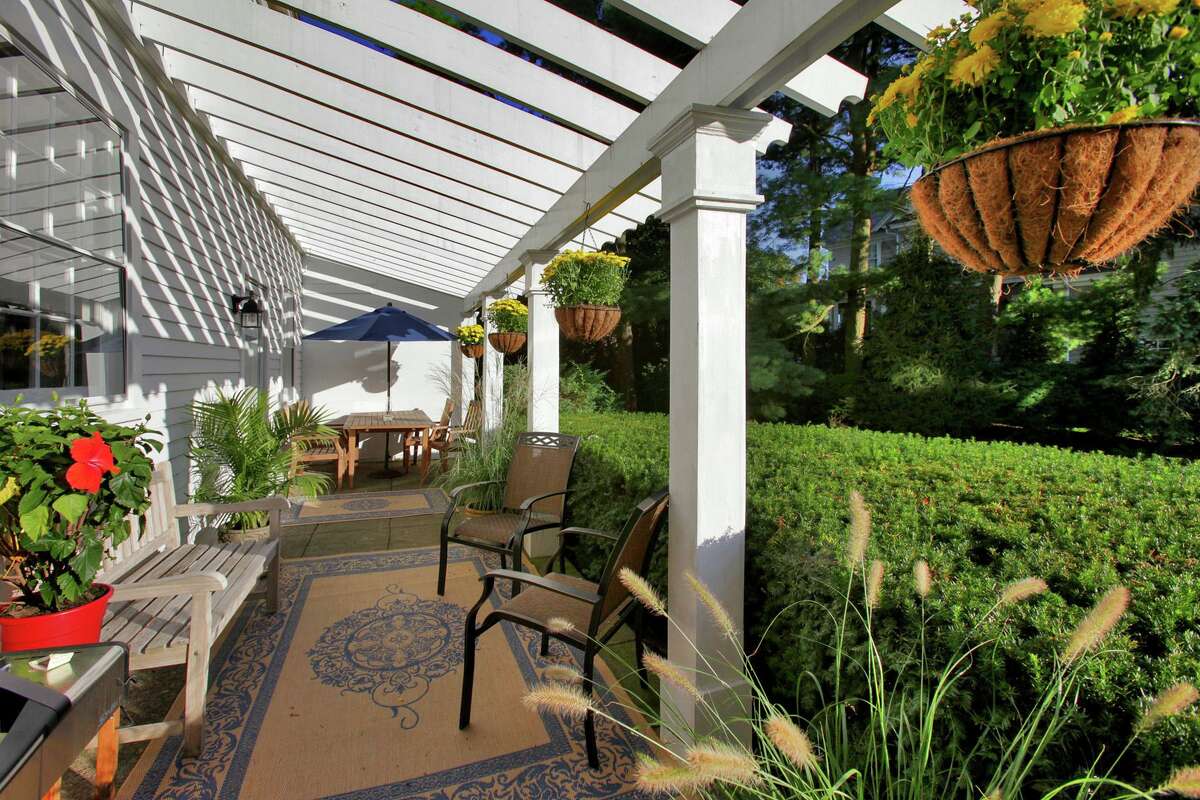 This property features a veranda with a pergola. Inside, the house features 11 rooms and 3,969 square feet of living space.