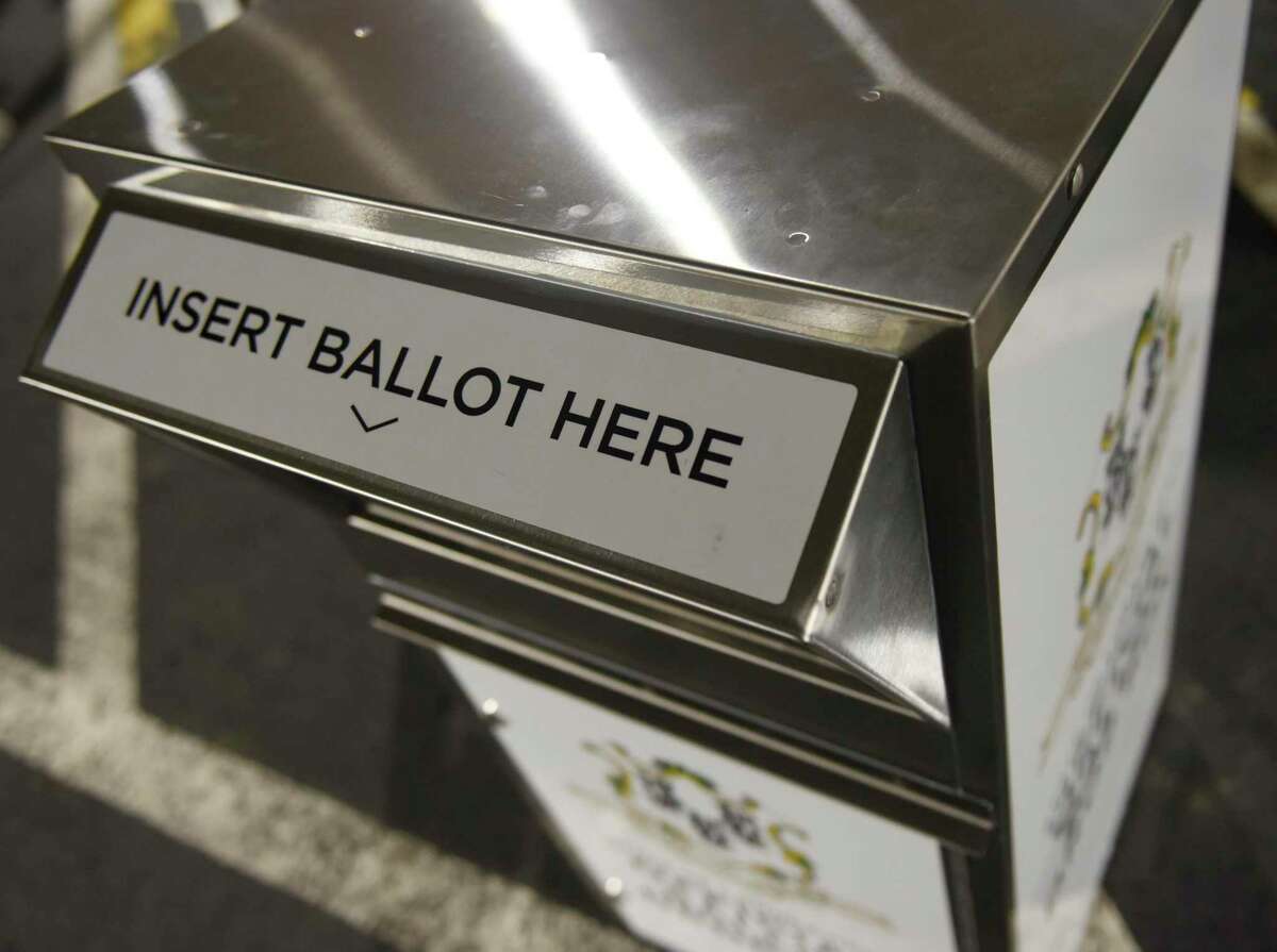 A Connecticut absentee ballot drop box is located outside the Government Center in Stamford, Conn. Tuesday, July 21, 2020. Secure metal bins have been placed in towns throughout the state for residents to place their absentee ballot applications and absentee ballots for the upcoming primary election on Aug. 11.