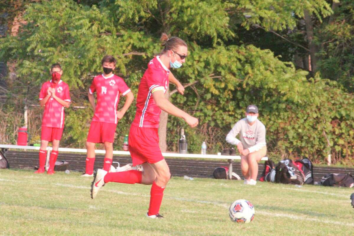 Aiden Mieras dribbles down field with the ball during action this season. (Herald Review/John Raffel)