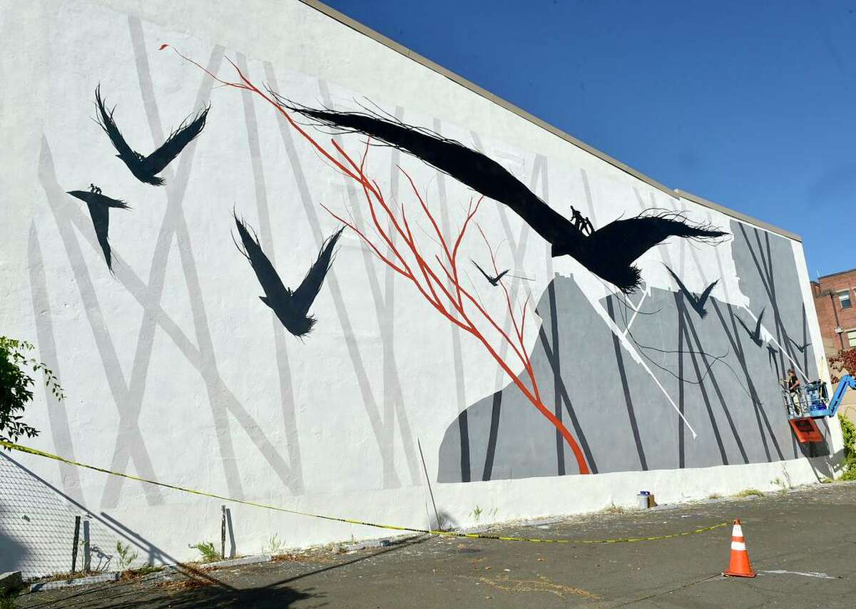 Nov. 7, 2020: Spanish artist David de la Mano of Uruguay paints a wall mural for Site Projects New Haven in the Ninth Square at 33 Crown Street as a tribute to William Lanson, the once enslaved man who expanded Long Wharf and helped build the Farmington Canal.