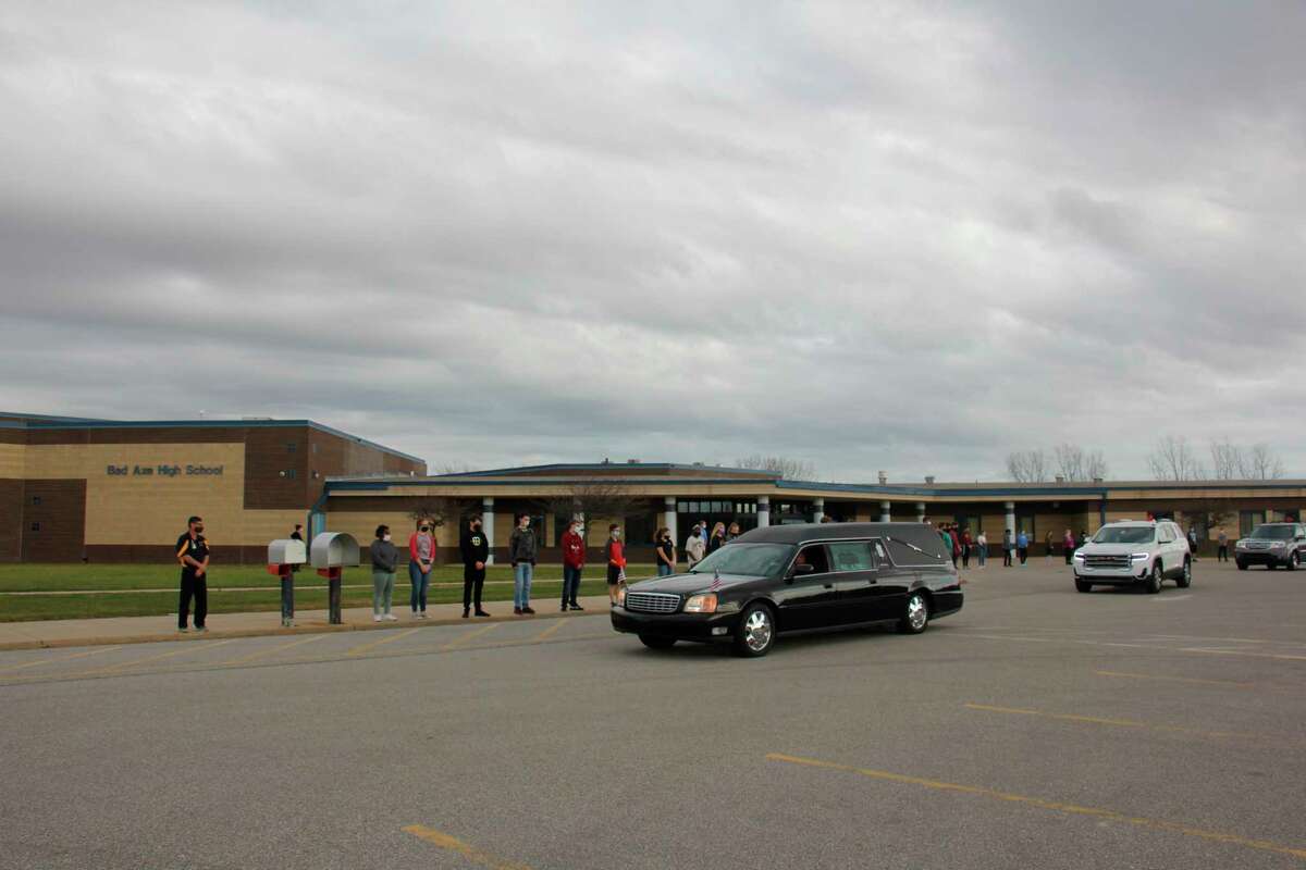 The Bad Axe student body lined the sidewalks of the elementary, junior high, and high school Tuesday November 11 to say a final goodbye to John Rowland, who is remembered as a Hatchet icon. (Paige Withey/Huron Daily Tribune)