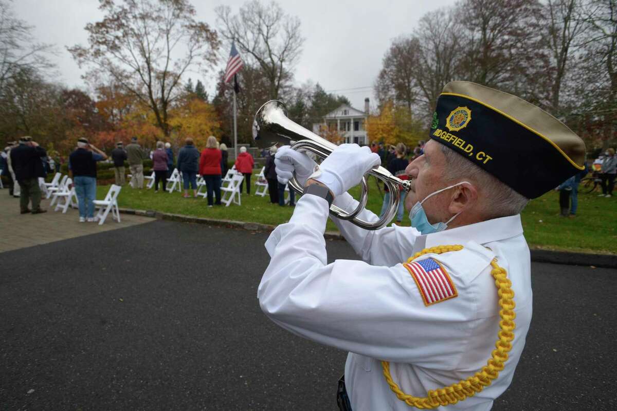 George Schuster presented taps at the American Legion Post 78 Veterans Day Ceremony at Lounsbury House, Ridgefield, Conn. Wednesday, November 11, 2020.