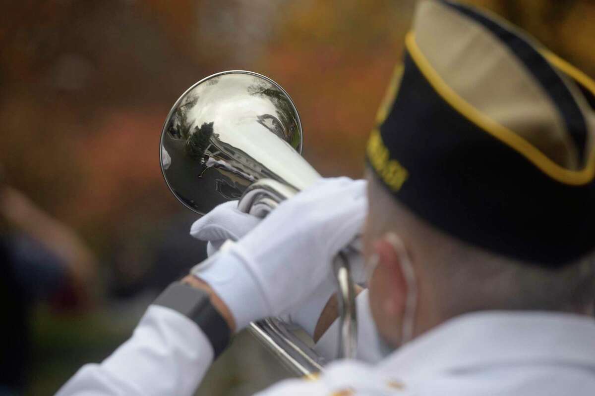 George Schuster presented taps at the American Legion Post 78 Veterans Day Ceremony at Lounsbury House, Ridgefield, Conn. Wednesday, November 11, 2020.