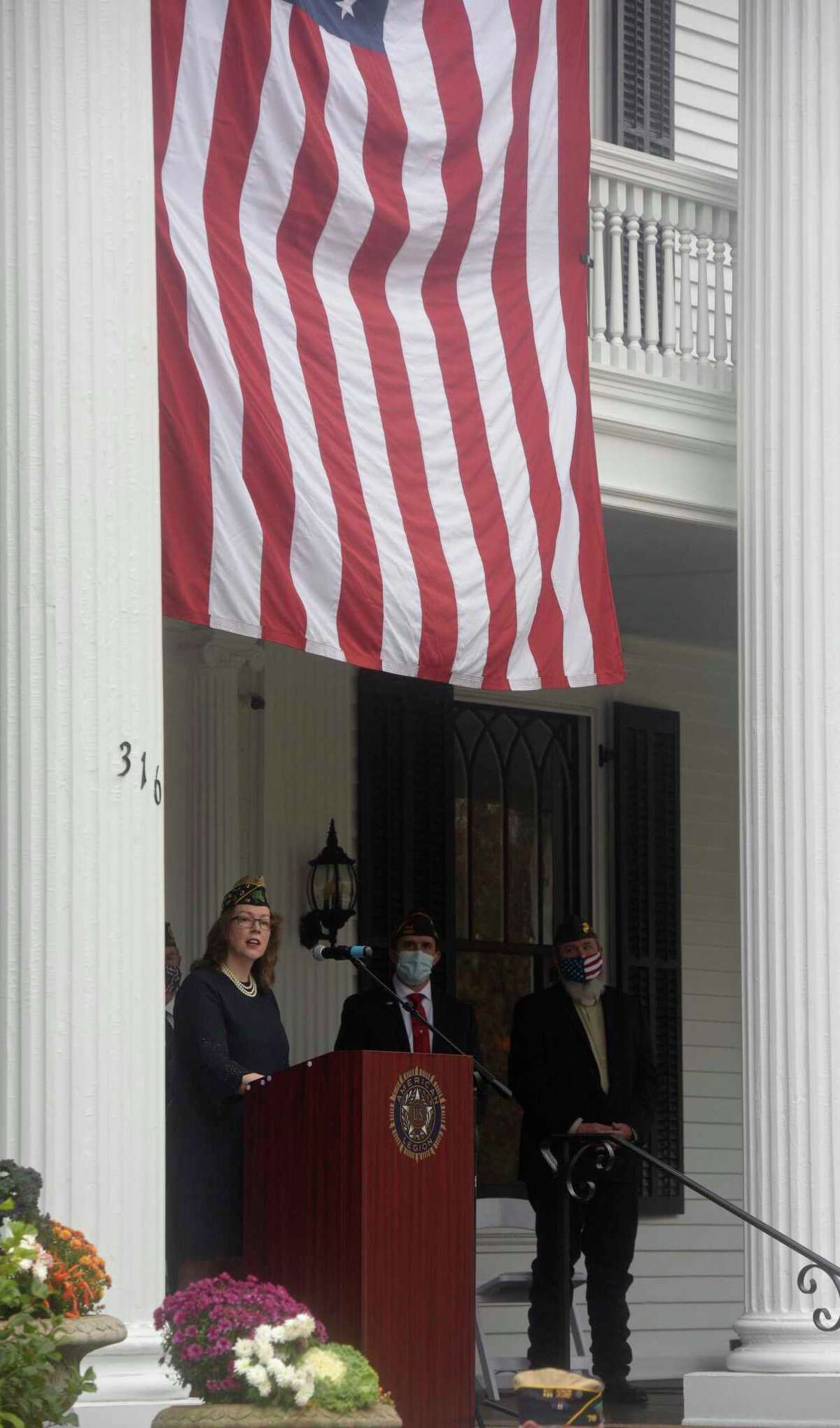 Legionnaire Lynn Isaac does a reading during the American Legion Post 78 Veterans Day Ceremony at Lounsbury House, Ridgefield, Conn. Wednesday, November 11, 2020.