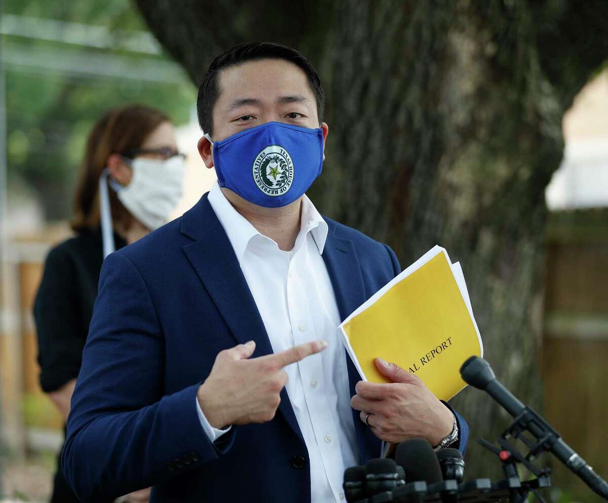 State Rep. Gene Wu, D-Houston, points to his copy of an audit of the Houston Police Department’s narcotics division as he speaks to the media Thursday, July 2, 2020, in Houston, in front of the home where Rhogena Nicholas and Dennis Tuttle were killed on Harding Street.