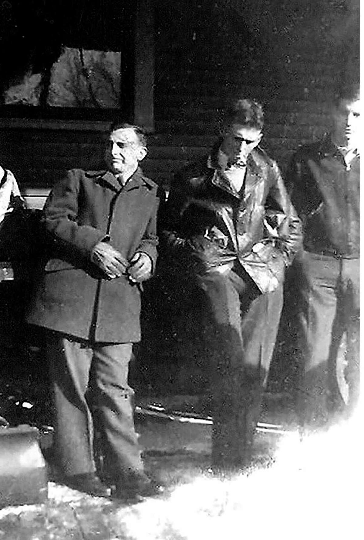 Ceo Bauer, Rolland Hill and Howard Berry wait at the train station in Alma as the head off to the army. (Courtesy photo/Bruce Garlock)