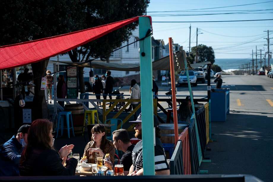 The Seven Stills distillery and Andytown coffee cafe in the Outer Sunset both have colorful parklets. Photo: Josie Norris / Special To The Chronicle