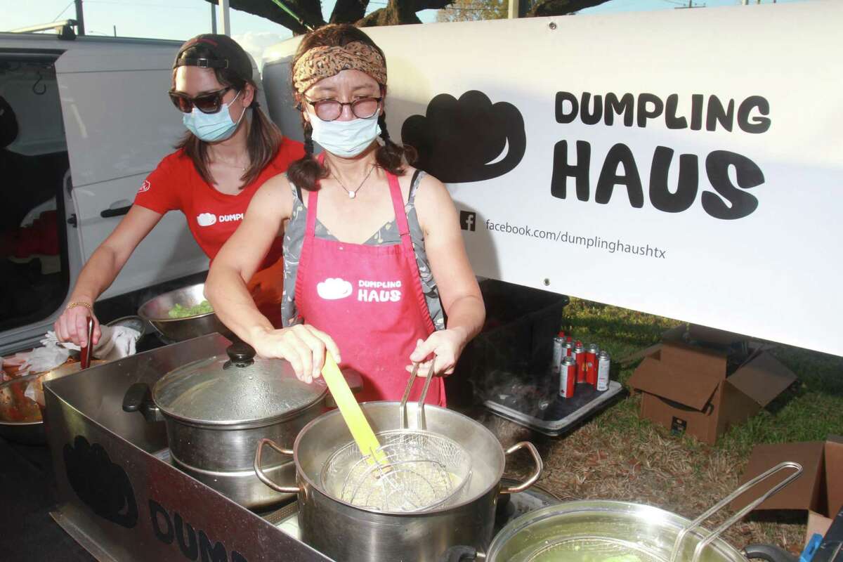 Amiley Lai, left, and chef Elaine Won of Dumpling Haus, at Urban Harvest's The Biggest Little Farm at Moonstruck Drive featuring a 4-course dinner in Houston on November 8, 2020.