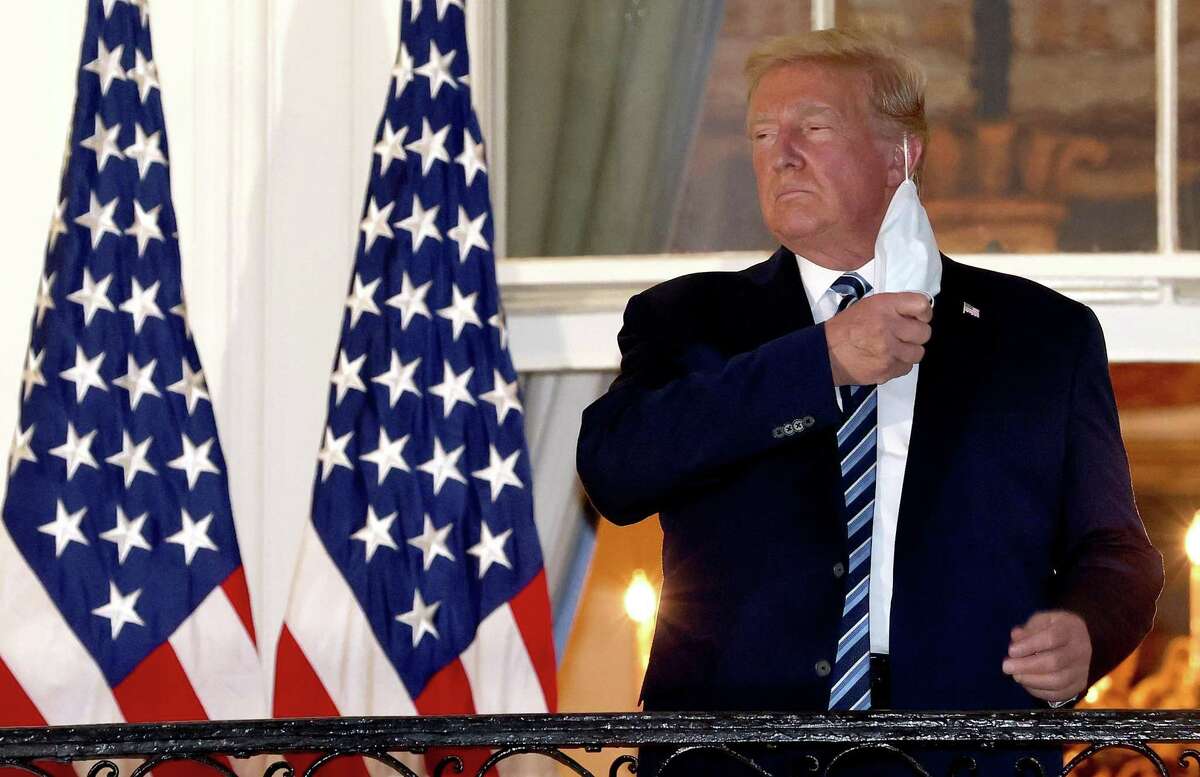 Just before midnight, President Trump fired off a flurry of false claims during a Twitter rant, once again claiming he won the election despite the fact that Joe Biden won Election 2020. Featured image: U.S. President Donald Trump removes his mask upon return to the White House from Walter Reed National Military Medical Center on October 05, 2020 in Washington, DC. Trump spent three days hospitalized for coronavirus. (Photo by Win McNamee/Getty Images)