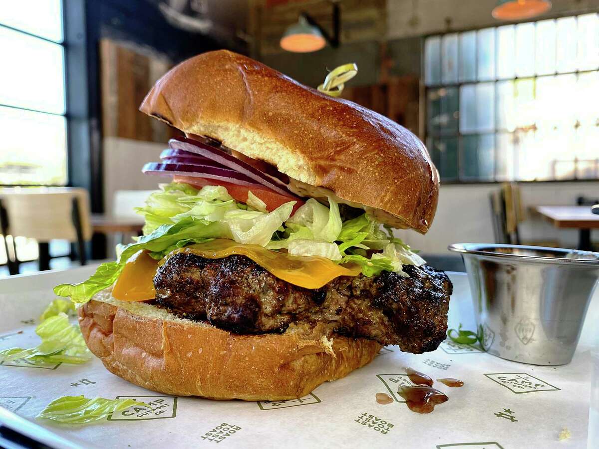 The Camp Burger uses grass-fed beef on a housemade brioche bun at Camp Outpost Co., a new venture from the Piatti family of restaurants.