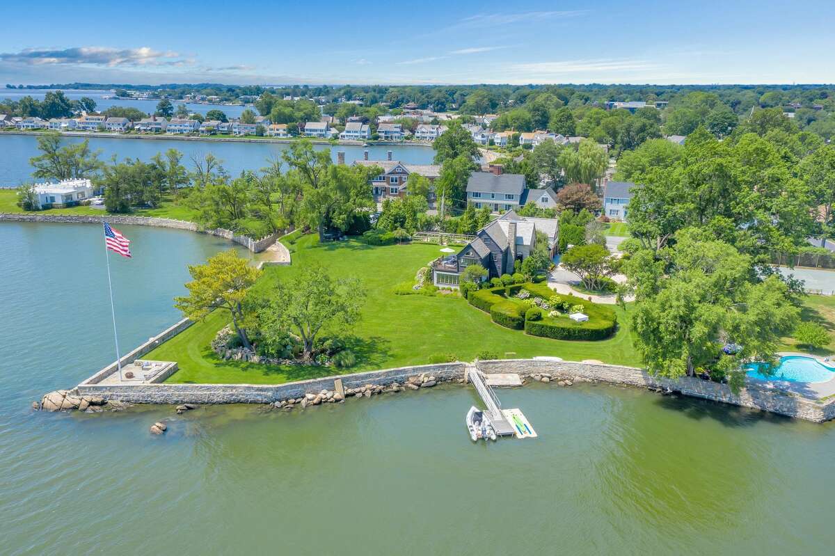 Waterfront home located at 236 Davenport Drive in Stamford, Connecticut.  Johnson described the home as a “charming waterfront estate.” The previous owners did not need to sell the home but were looking to do so if the conditions were right, Johnson said. They raised their children in the home and were ready to downsize and embark on a new adventure. The residence, built in 1920, is stationed on 1.28 waterfront acres with 270-degree panoramic views of the Long Island Sound. It has a private dock and secluded beach, directly accessible from the property.