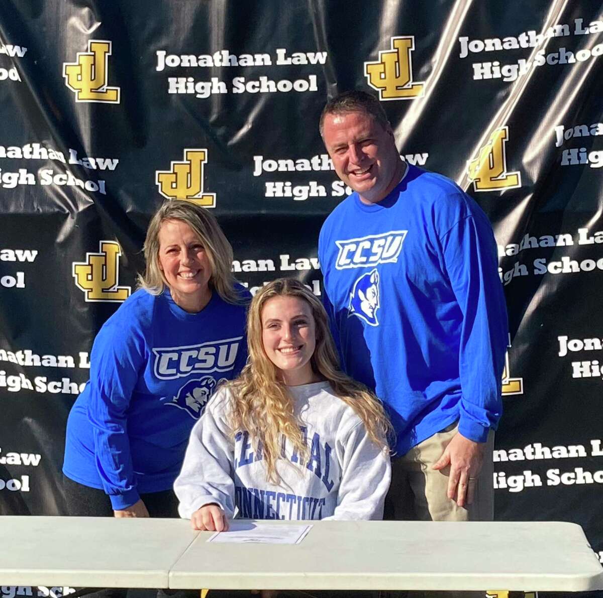 Law volleyball standout Alexis Neider is joined my parents John and Kelly when she signed to play for Central Connecticut State University in the Division I Northeast Conference.