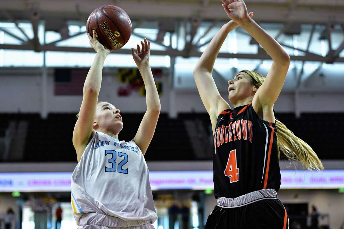 TOWSON, MD - MARCH 16: River Hill Hawks guard Erin Devine (32) attempts shot over Middletown Knights guard Saylor Poffenbarger (4) during the third quarter at SECU Arena. (Photo by Terrance Williams for The Washington Post via Getty Images)