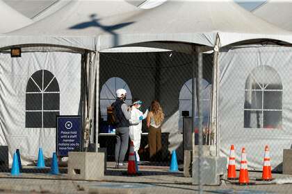 A COVID-19 testing site is open at Pier 30 in San Francisco, which has restrictions far more stringent than its yellow tier allows, a cautious approach the city has maintained throughout the pandemic.