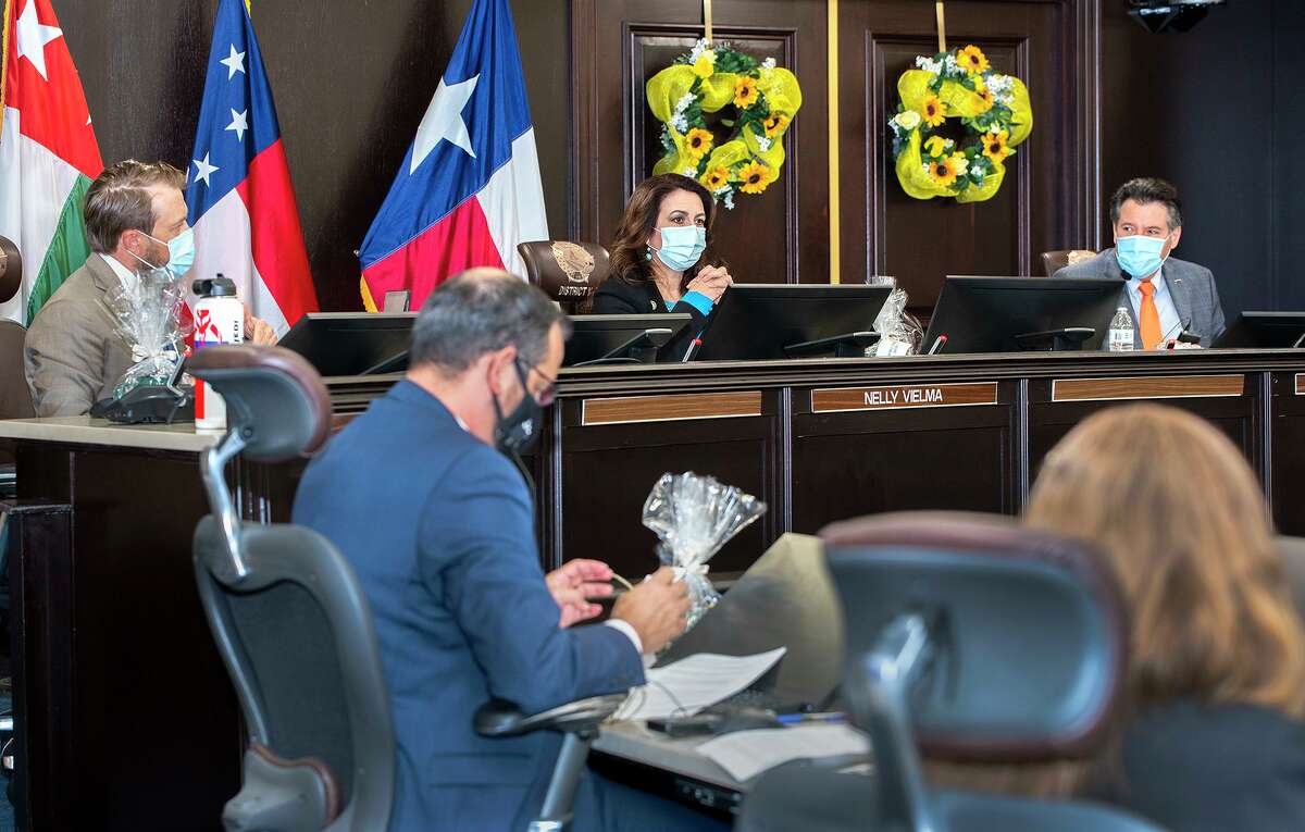 Laredo City Council members George Altgelt, Nelly Vielma and Mayor Pete Saenz are pictured with City Manager Robert Eads in the foreground during a council meetings on Sept. 8 at City Hall.