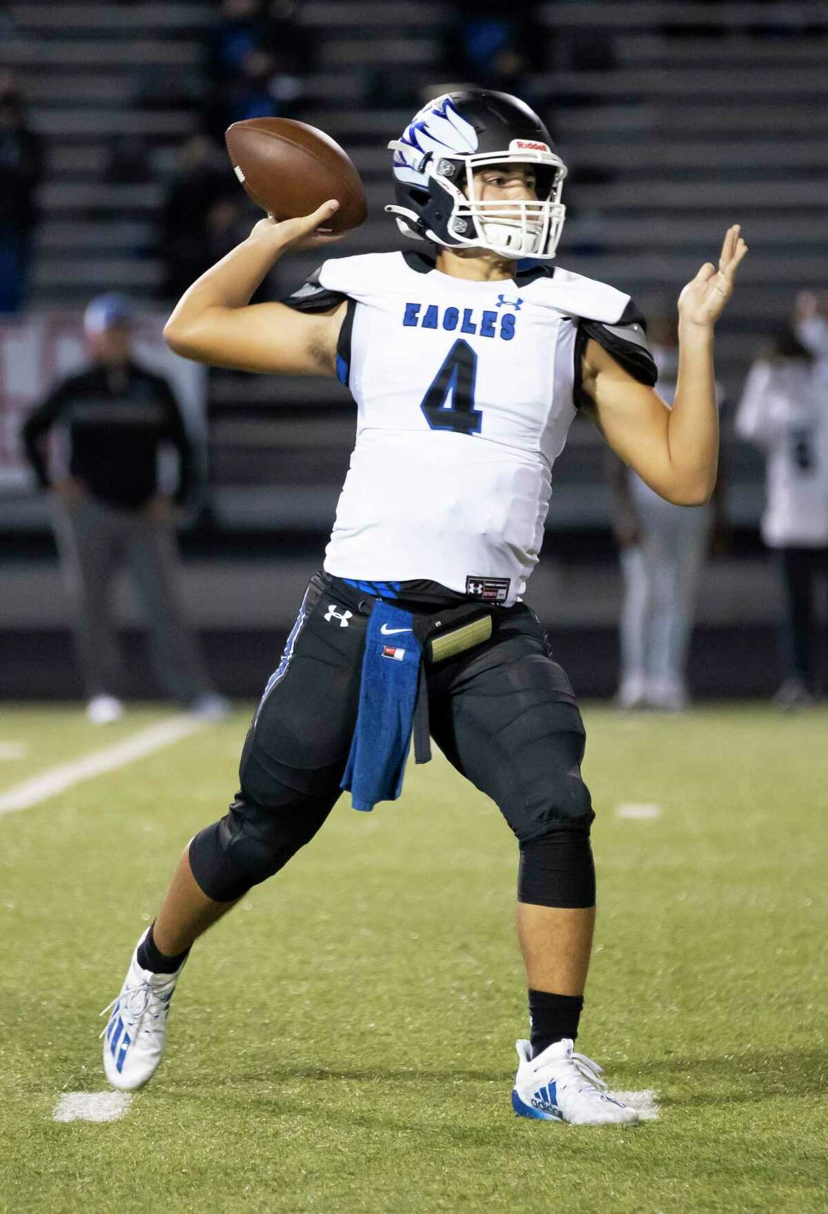 New Caney quarterback Jaydon Tutwiler-Drew (4) passes the ball during the first quarter of a District 8-5A (Div. I) football game against Caney Creek at Moorhead Stadium in Conroe.