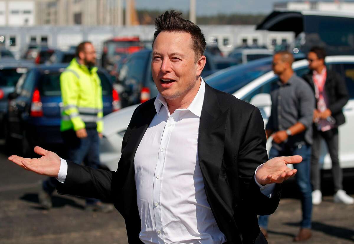 A maskless Elon Musk visits the construction site of a future electric-car plant in Berlin in September. The Tesla CEO recently said he had received both positive and negative test results for the coronavirus.