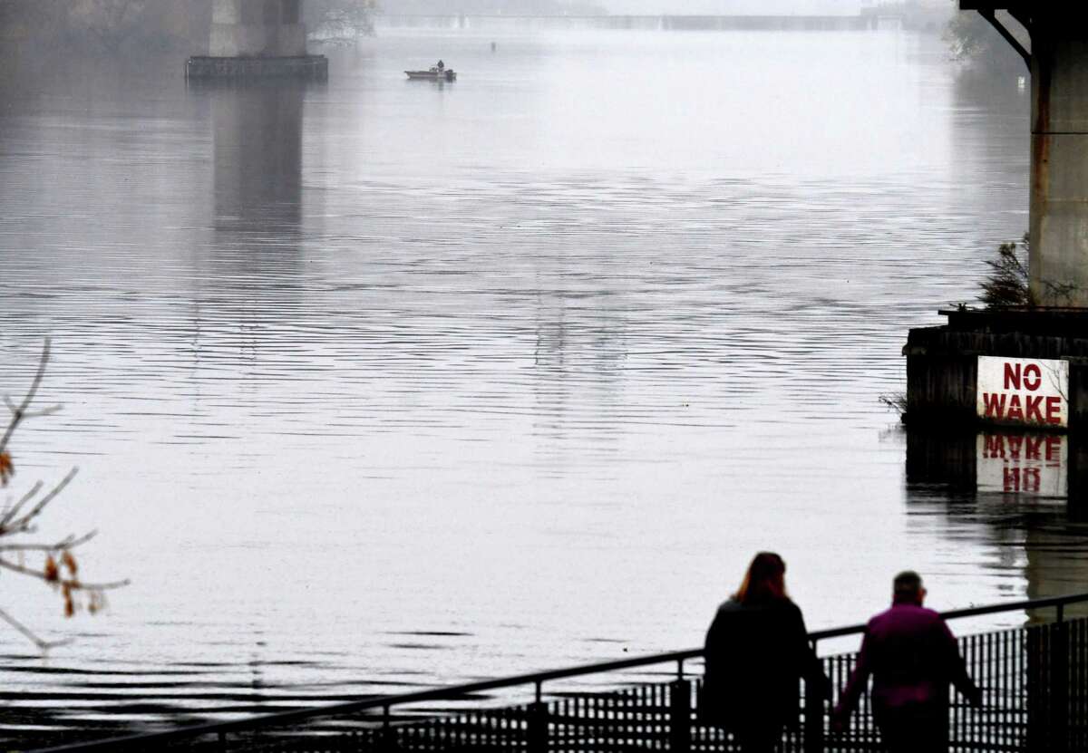Under misting overcast conditions, a solitary angler works the Hudson River below Federal Lock on Friday, Nov. 13, 2020,13, 2020, in Troy, N.Y. (Will Waldron/Times Union)