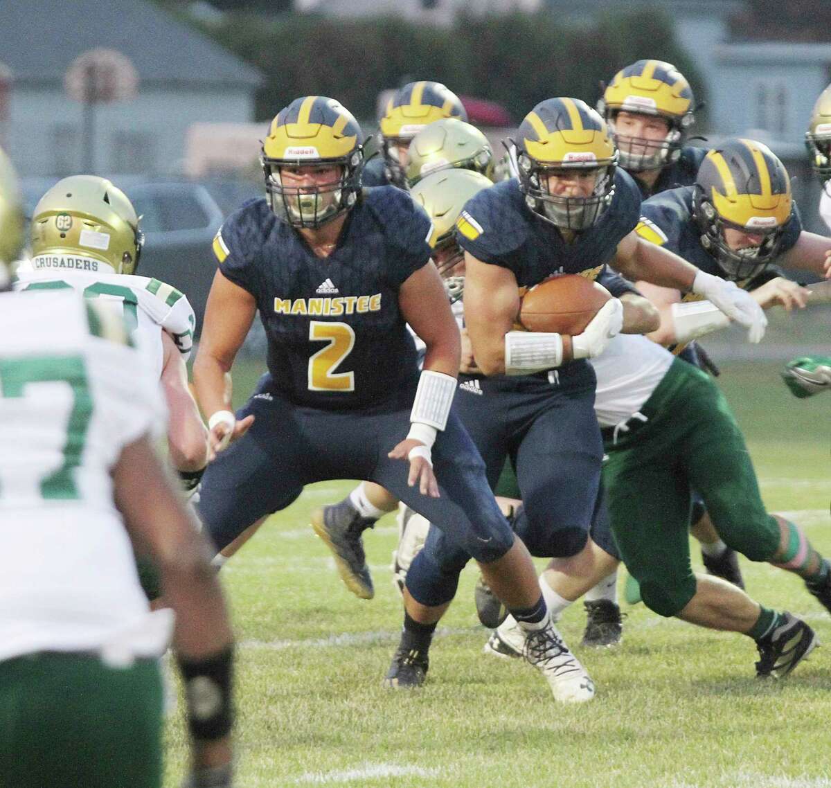 Manistee seniors Brady Mikula (left) and Laden Powers (right) were first-team selections on the all-Lakes 8 Conference list this season, Brady as a defensive lineman and Powers as an offensive skills position. (News Advocate file photo)