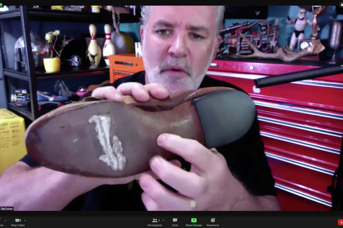 Foley sound-effect artist Adam DeCoster shows off an old loafer shoe he has used for decades to re-create footsteps. He shares his craft in an Airbnb online experience called 