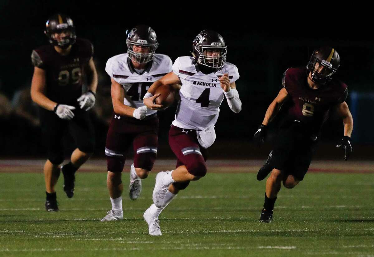 Magnolia quarterback Travis Moore (4) runs for a 40-yard gain during the second quarter of a District 8-5A high school football game at Magnolia West High School, Friday, Nov. 13, 2020, in Magnolia.
