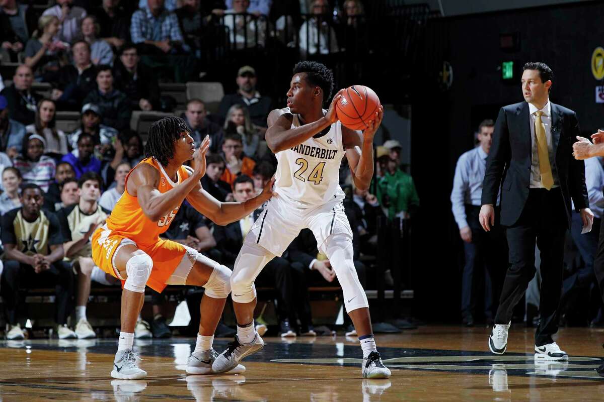 NASHVILLE, TN - JANUARY 23: Aaron Nesmith #24 of the Vanderbilt Commodores handles the ball against Yves Pons #35 of the Tennessee Volunteers during the game at Memorial Gym on January 23, 2019 in Nashville, Tennessee. Tennessee won 88-83 in overtime. (Photo by Joe Robbins/Getty Images)