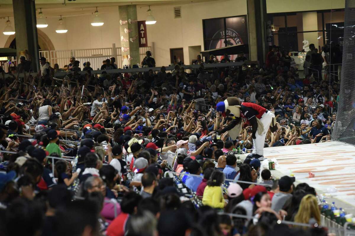 Members of the crowd cheer during the Tecolotes’ home opener April 6, 2019 at Uni-Trade Stadium. The team is considering moving due to a dispute with the City of Laredo.