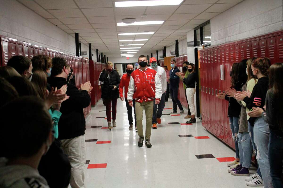 Division 3 state champion Hunter Jones and his coaches are welcomed back to Benzie Central with fanfare on Nov. 12 in celebration of his achievement. (Photo/Robert Myers)