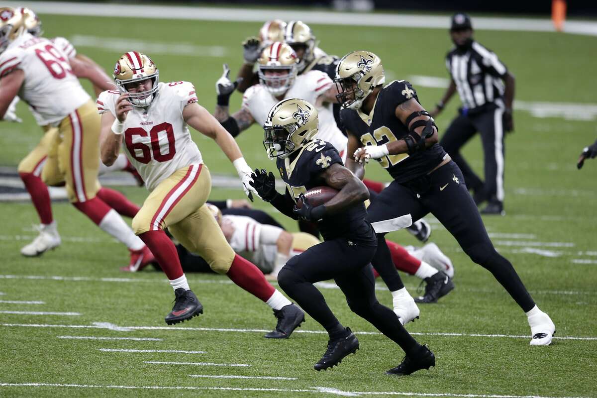 New Orleans Saints strong safety Malcolm Jenkins (27) returns an interception in the second half of an NFL football game against the San Francisco 49ers in New Orleans, Sunday, Nov. 15, 2020. (AP Photo/Butch Dill)
